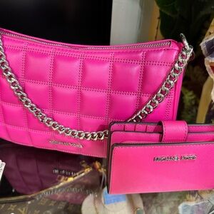 Michael Kors Pink Quilted Shoulder Bag and matching wallet.